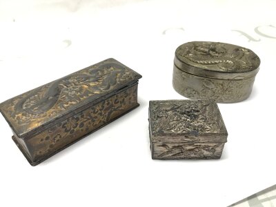 Three Chinese metal boxes with embossed dragons , length 9cm, 6.5cm, 3.5cm