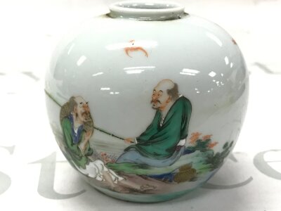 A small Chinese jar with a fishing scene design and a six character mark at base. 8cm tall