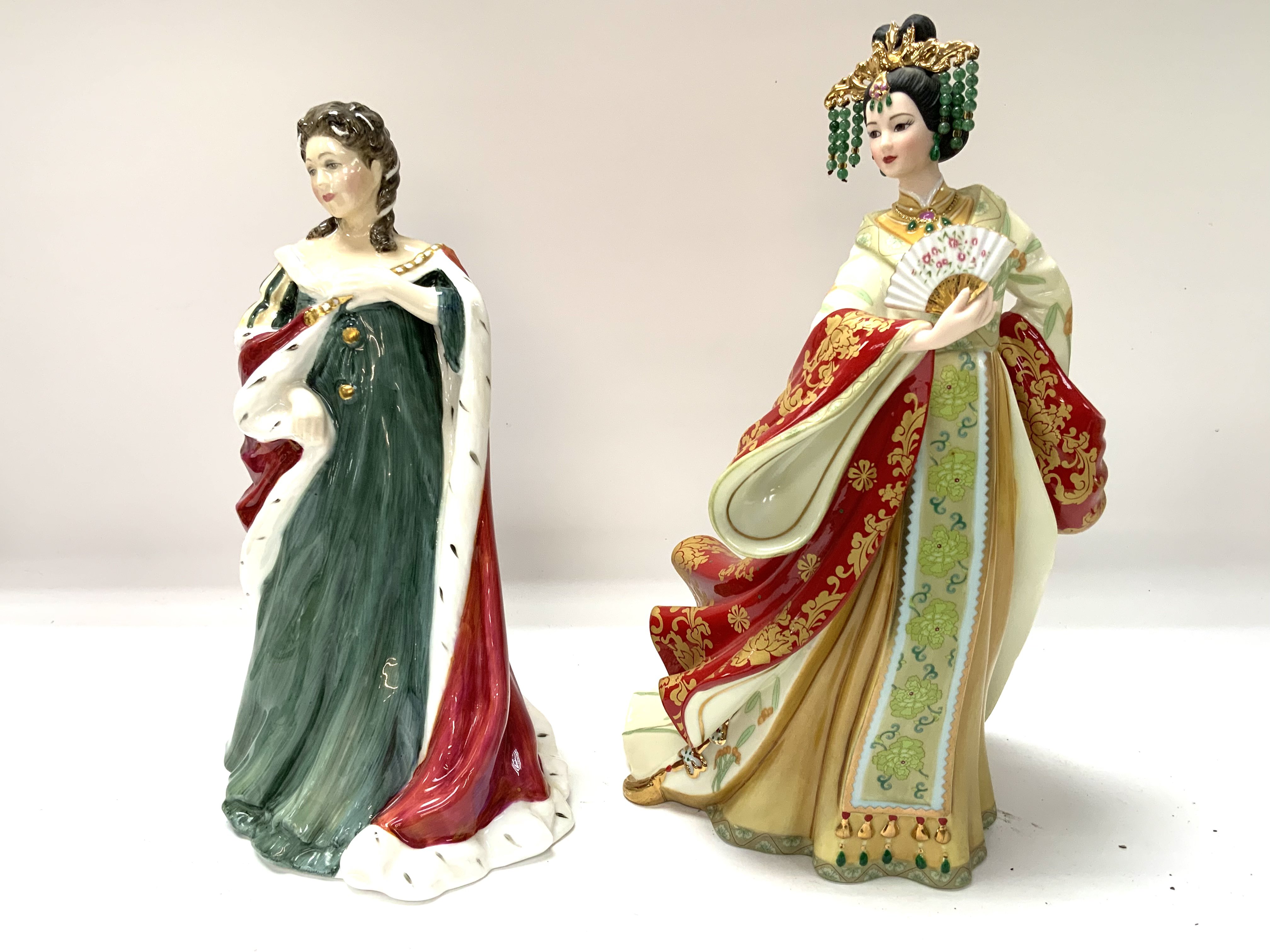 A Royal Doulton figure. Queen Anne, Queens of the Realm, Danbury Mint Jade Empress. (D).