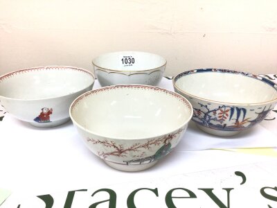 Four English Porcelain 18th century tea bowls decorated in the oriental style with figures one marked with a Worcester mark chips and hairline cracks (4)