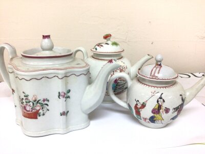 Three 18th century English porcelain tea pots decorated in the Chinese style with figures two canon ball shaped figures and a shaped tea marked on the base 171. (3) some restoration.