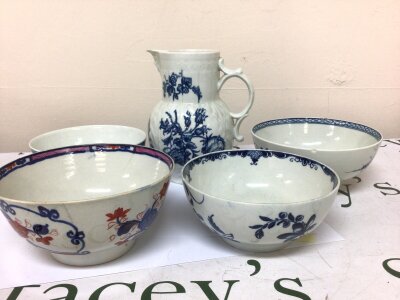 An 18th century Worcester porcelain bearded jug with impressed decoration height 18cm blue and white flowers and three tea bowls blue and white and Imari pattern hairline cracks minor chips. (5)