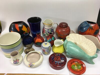 A collection of Poole ceramics comprising vases, jugs etc.