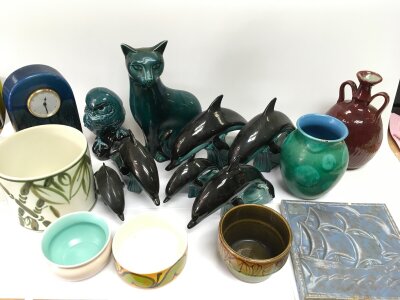 A collectIon of Poole ceramics including a mantle clock, animal figures, tile etc.