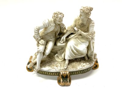A small German porcelain figural group,