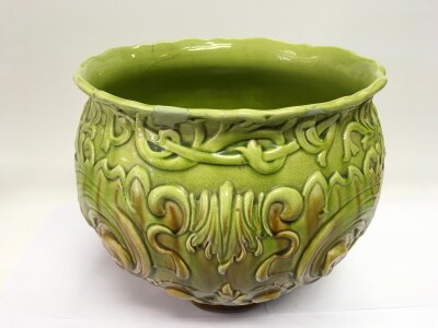 A German green glazed 20th Century floor vase, a/f, approx height 23.5cm.