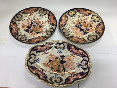 Three Royal Derby porcelain plates, one with a shaped edge, diameters approx 29.5cm and 25cm.