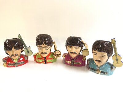 Four boxed Peggy Davis ceramic figure busts of the Beatles Sgt Pepper band pop legend character jug
