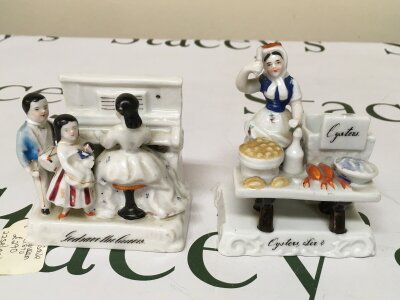 Two Victorian Fairings A, God save the Queen, B, Oysters Sir?
Item A's paint work is quite faded, some details are still visible on the figure's faces. Item B still has details visible. small. Small chips at the back and above Oysters sign.