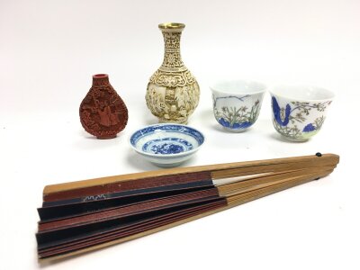 A collection of Chinese items including snuff bottle, cups, fan etc