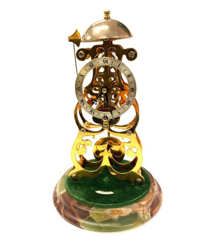 A Contemporary brass skeleton clock by Thwaites & Reed, with passing strike on a bell, the 3.25" silvered dial upon foliate arched supports and coloured marble stepped base, under a glass dome, 11" high
