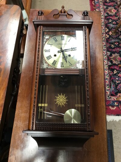 A wall clock ,keeps good time working order. 70cm tall,29cm wide