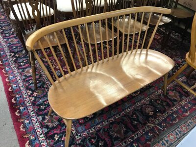 An Ercol cottage style love seat. 112cm wide 75cm tall 43cm long