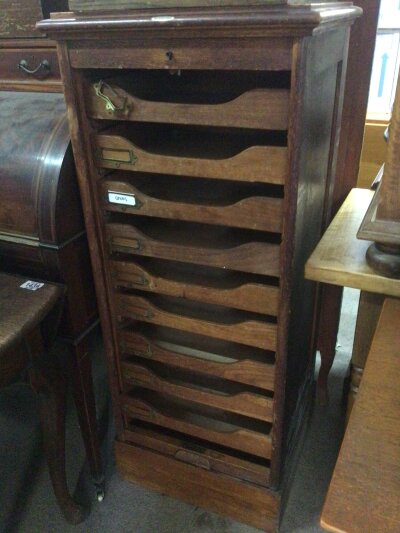 An oak Tambour cabinet with a flight of drawers. For restoration