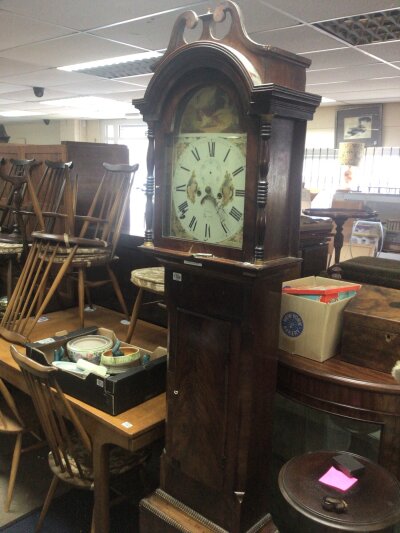 A 19th century Mahogany long case clock with an arched painted dial maker Dorel of Yeovil eight day going.