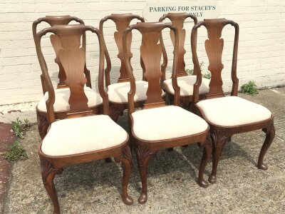 A mahogany dining table with six Queen Anne style chairs. 50cm wide,44cm long, 102cm tall