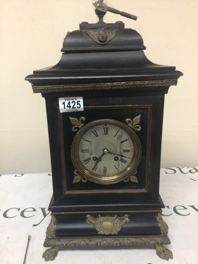 A Victorian Ebonized mantle clock with gilt metal mounts and a slivered dial 45cm high 25cm wide