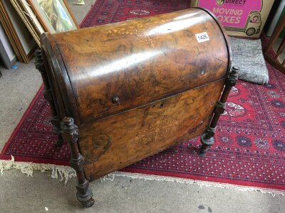 A Victorian walnut domed toped Canterbury