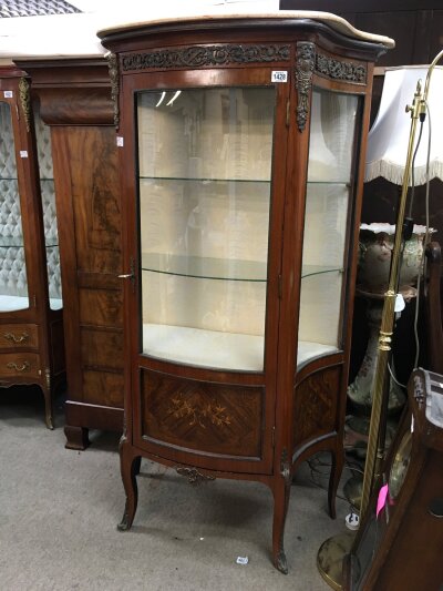 A French Style cabinet having sinkge door, enclosing two glass shelves. With marble top and classical mounts on cabriole legs