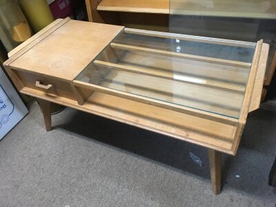 A modern design teak table with a glass top and drawers, approx 89cm x 40cm x 41cm.