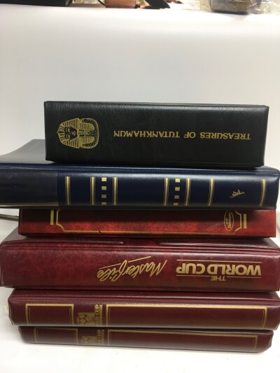 A mixed lot of stamp albums including signed first day covers other first day covers and more stamps.