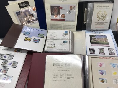 A large collection of stamps albums and coin covers. Including four pocket watches