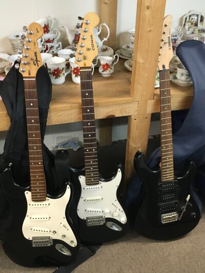 Three electric guitars- Squire strat, C. Giant strat, Yahama ERG 121