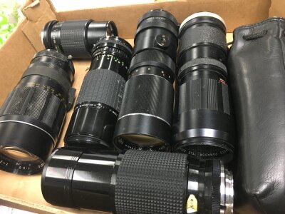 Seven vintage camera lenses