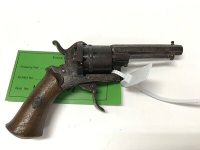 19th century Belgian pinfire revolver, featuring a six-shot capacity and an octagonal barrel. Has a folding trigger mechanism.