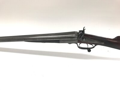 antique double-barrel side by side hammer shotgun featuring barrels with a distinctive pattern. Boss & Co. 73 St. James Street London. Barrel length 30 inches. Comes with leather case. Black powder only. 
Serial 3017.

PLEASE NOTE THAT A SHOTGUN LICENSE IS REQUIRED TO PURCHASE THIS ITEM. COLLECTION AND VIEWING BY APPOINTMENT ONLY.