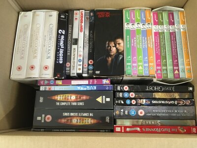 Four boxes of DVDs including box sets.
