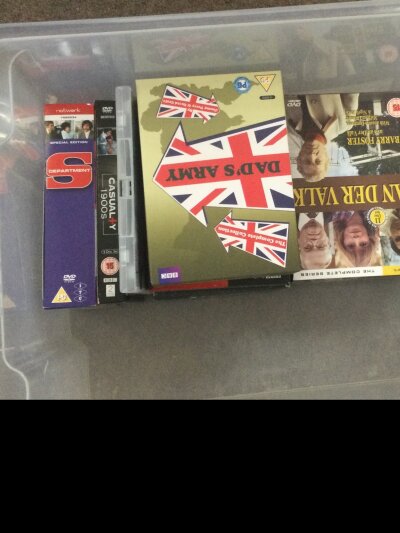 Two boxes of assorted blue ray and DVDs including Omen dads army and Dr strange love