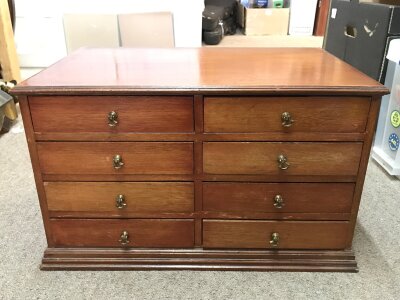 A small chest for trinkets with 8 drawers. 53cm wide ,31cm tall, 33cm long