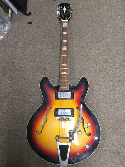 A Japanese Semi-hollow body Electric guitar (possibly Matsumoku) with Eddie Moors music bournemouth sticker on back