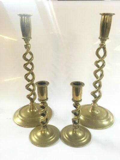 A good pair of vintage open twist candlesticks and a small pair of similar candlesticks. 14 and 30cm tall