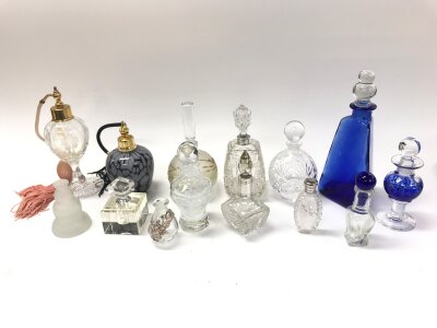 A collective lot of 14 assorted scent bottle and toilet jars.