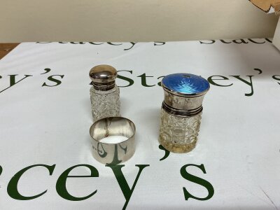 a collection of a silver napkin ring, a silver miniature cut glass scent bottle, a silver Guilloche enamel and cut glass jar.