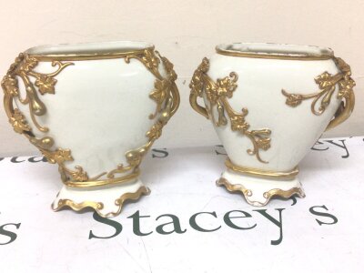 A Pair of 19th century Worcester porcelain vases with raised gilt foliage marks to the base Height 19cm