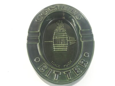A pottery Combes Bitter advertising pub ashtray. 18cm wide 24cm tall
