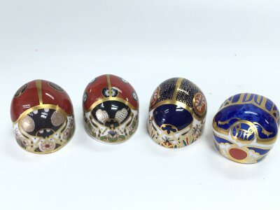 Four royal crown derby paperweights in the form of beatles, including scarrab beetle . With damage