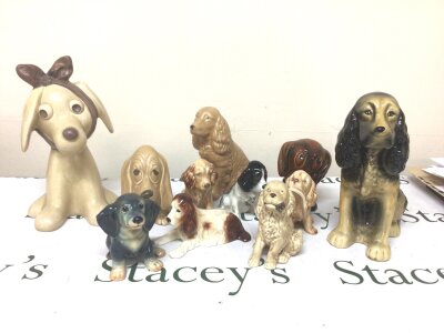 A Collection of Sylvac dog ornaments of mixed size and design including some glazed examples. No obvious damage maximum height 31cm