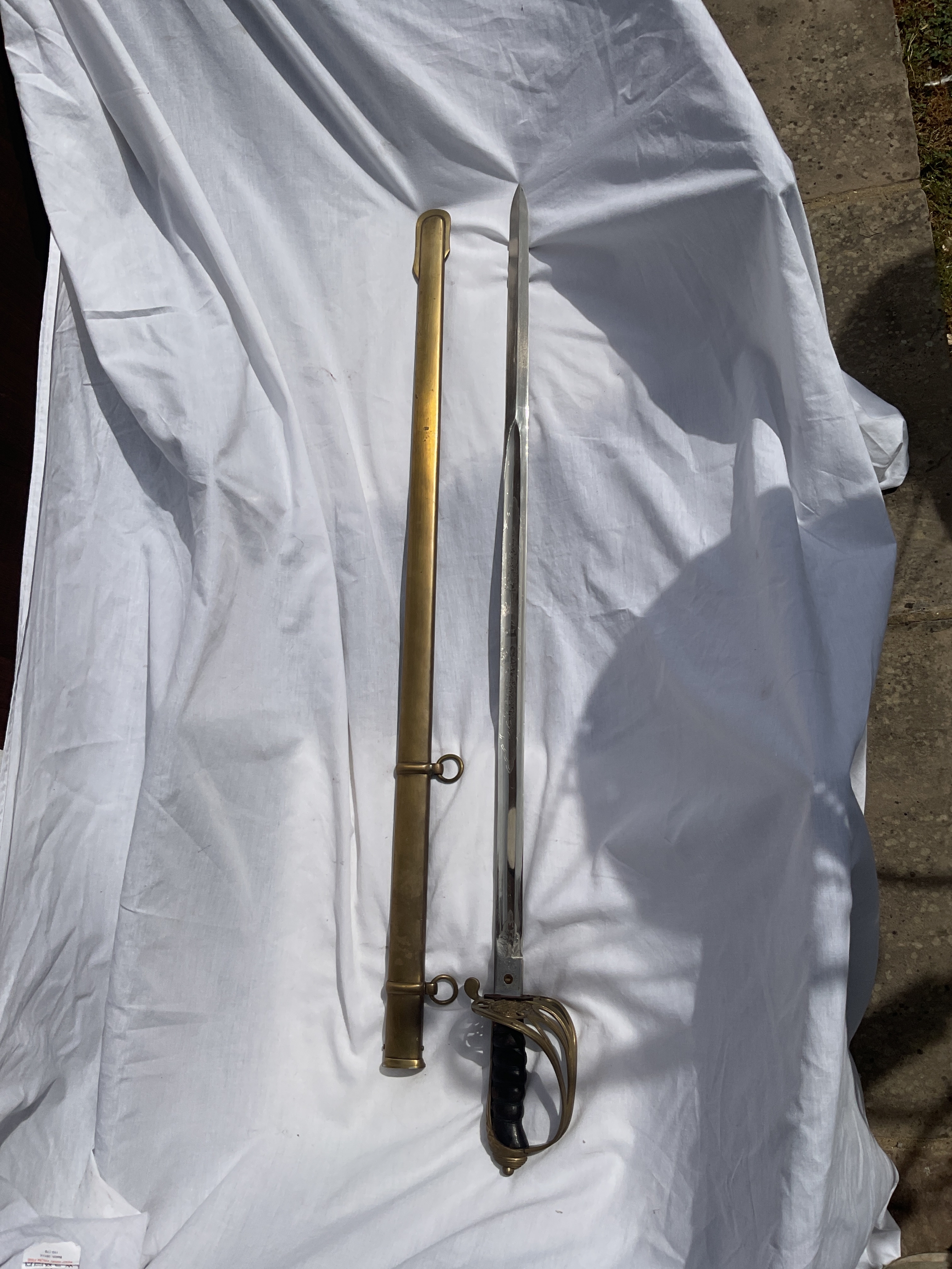 Victorian 1822 pattern officers sword and sheath with engraved blade.