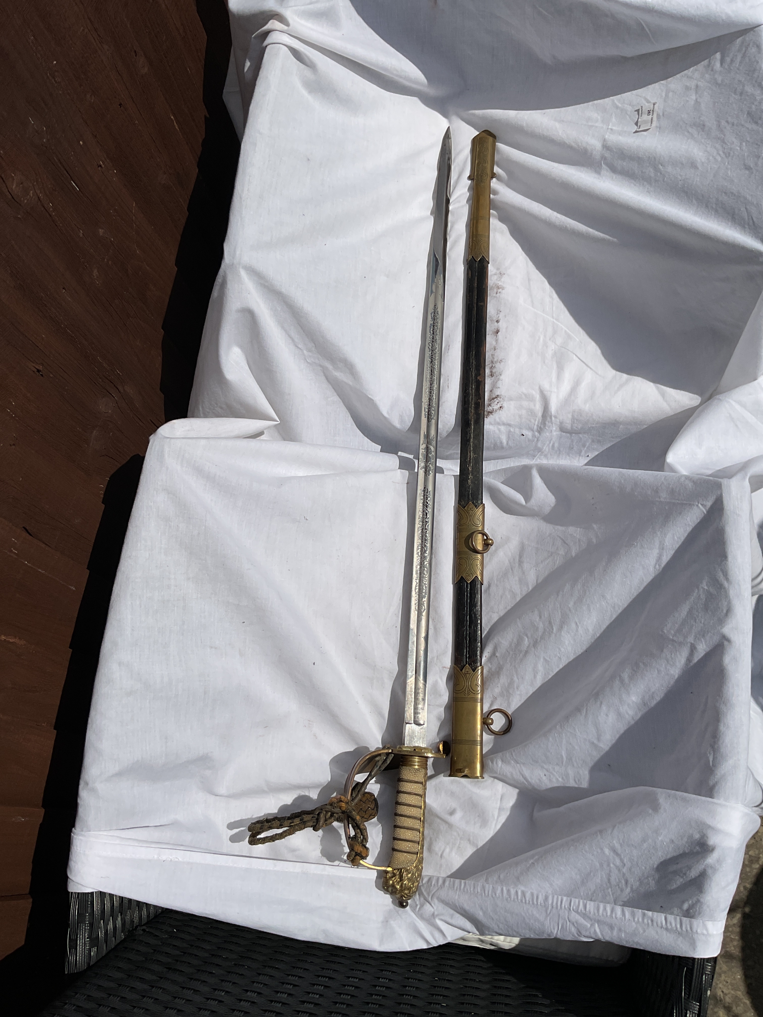 WWI GVR Navy officers sword, sheath and portepee, blade by Samuel Brothers Ltd. 