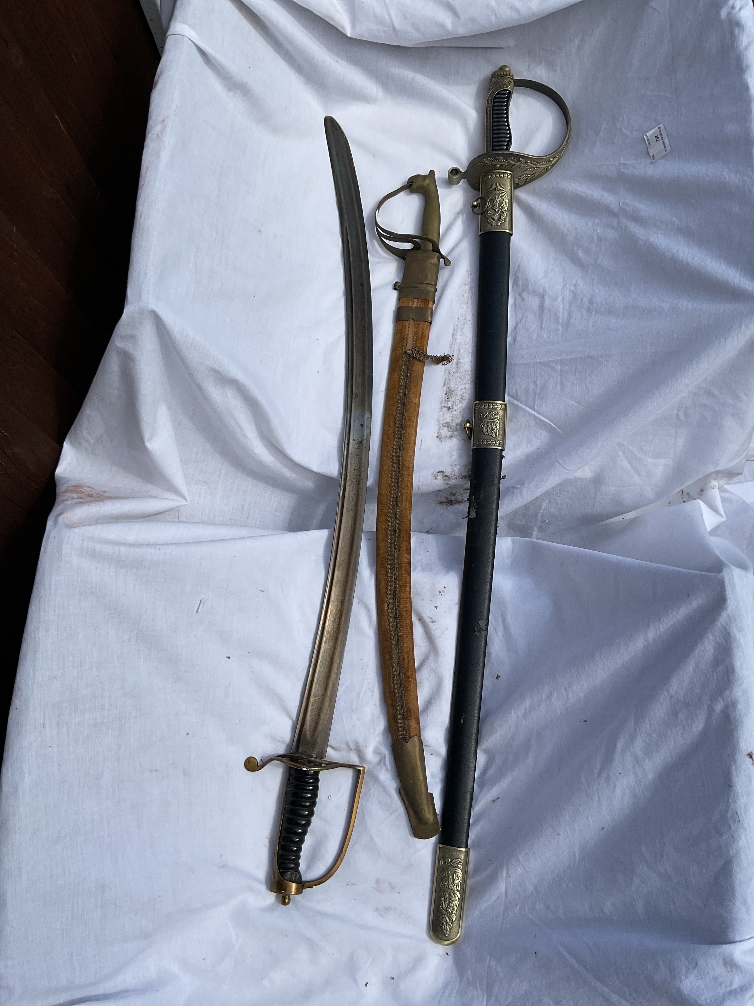 Three reproduction swords 