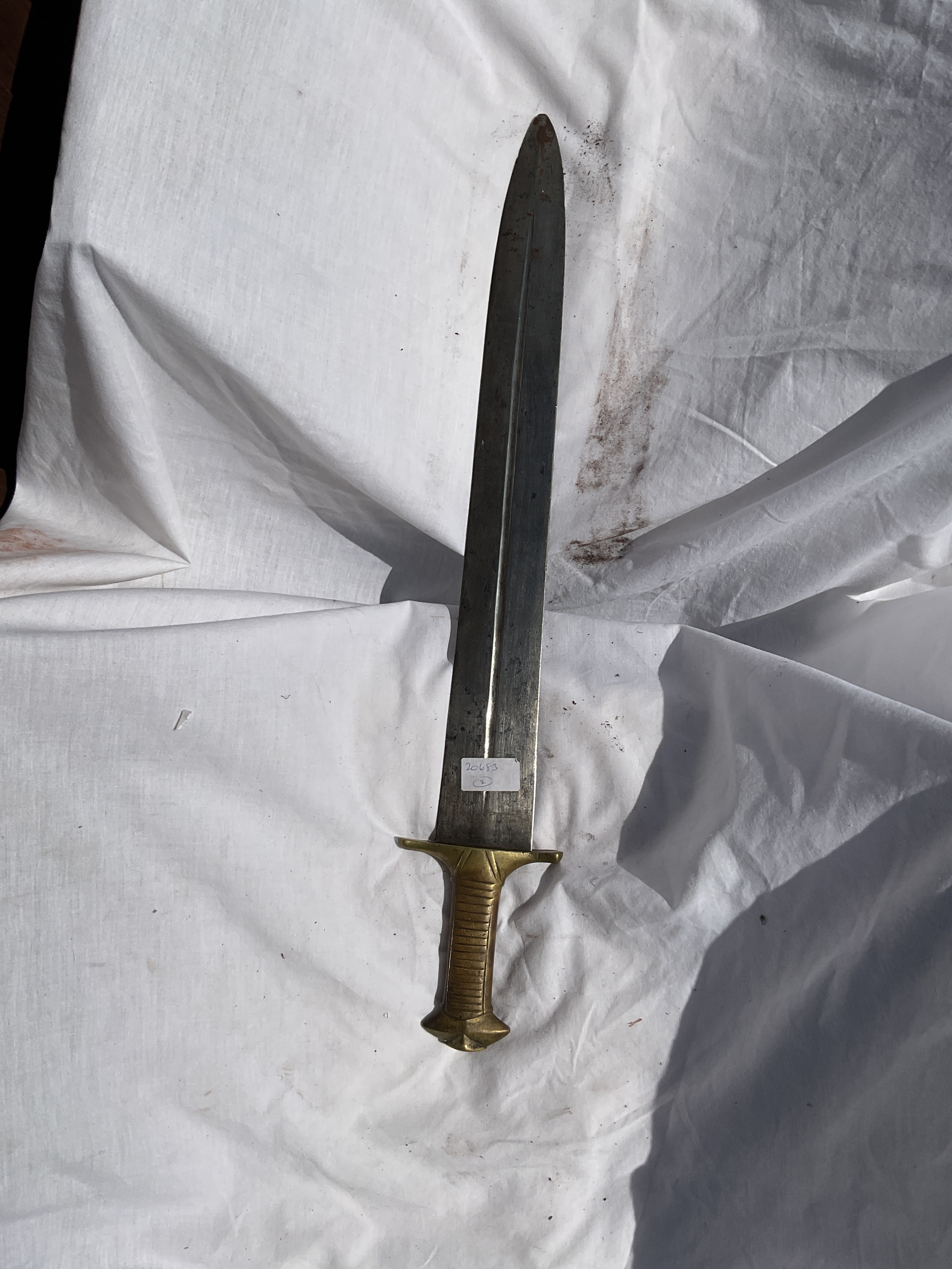 Brass handled gladius artillery sidearm type weapon.