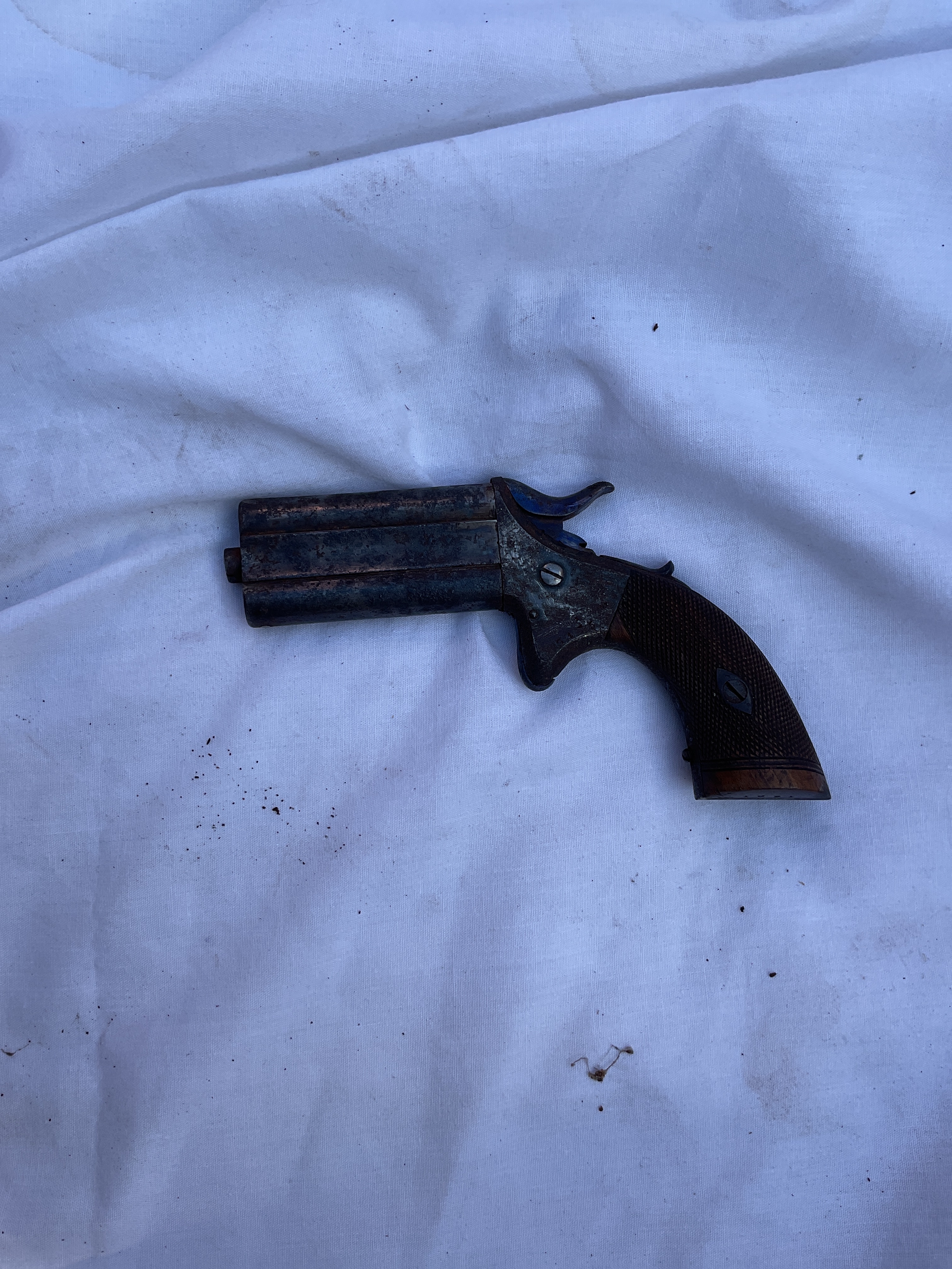 Woodwards .32 cal swivel over under Deringer. Obsolete calibre.