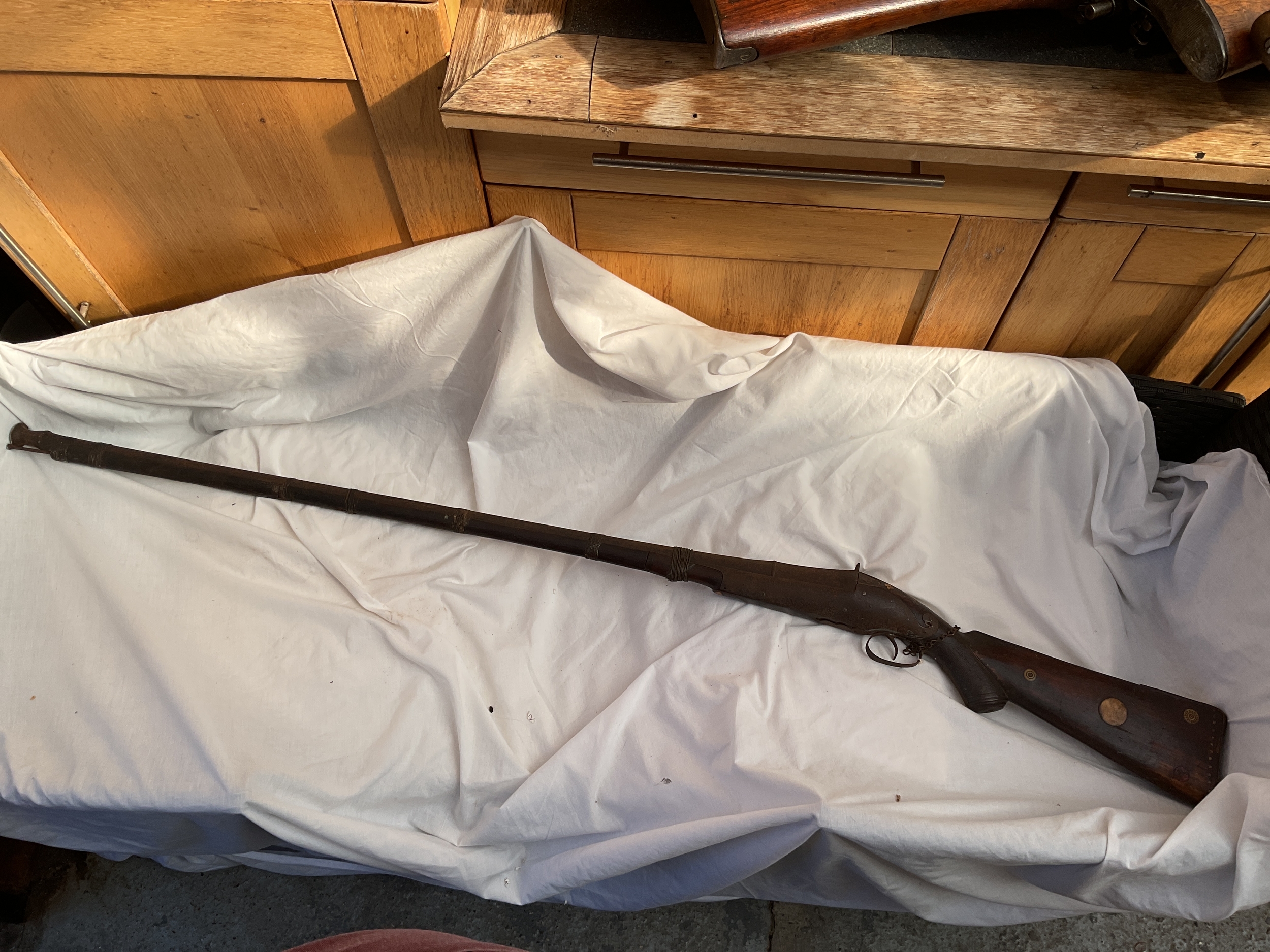 Muzzle loading percussion Arab rifle with inlays to the stock.