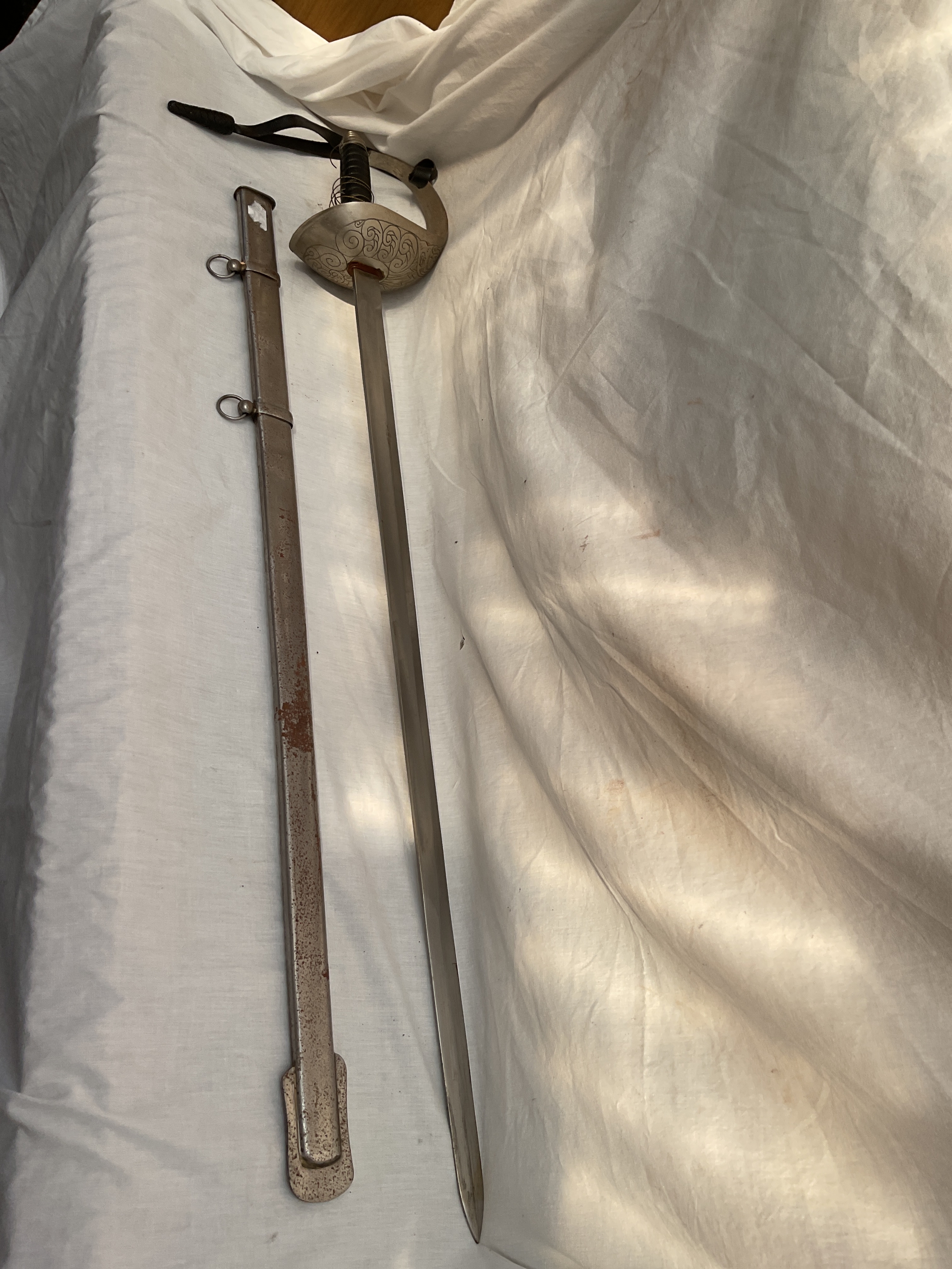Reproduction cavalry sword and sheath.