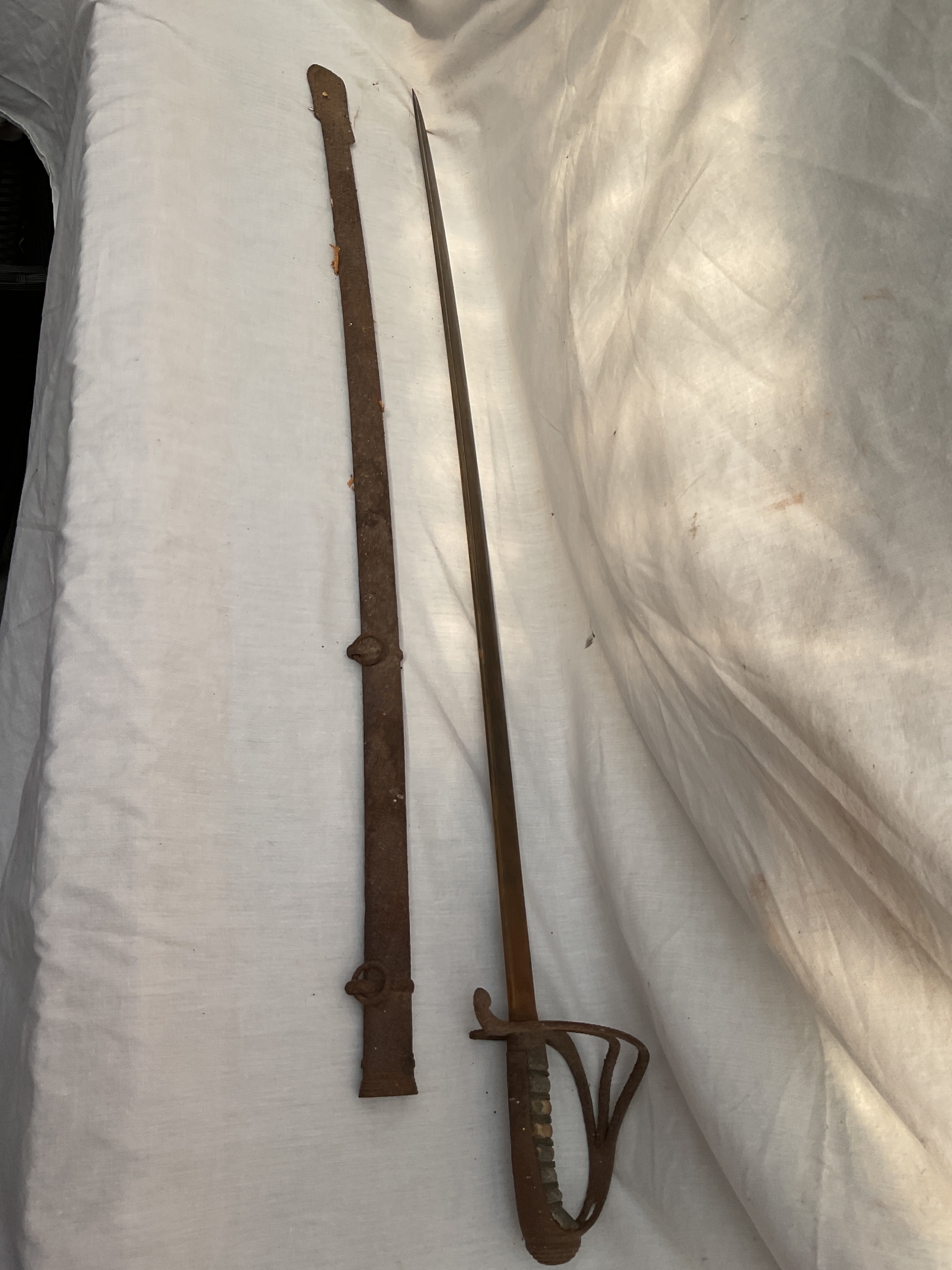 Restoration pipe backed sword and sheath.