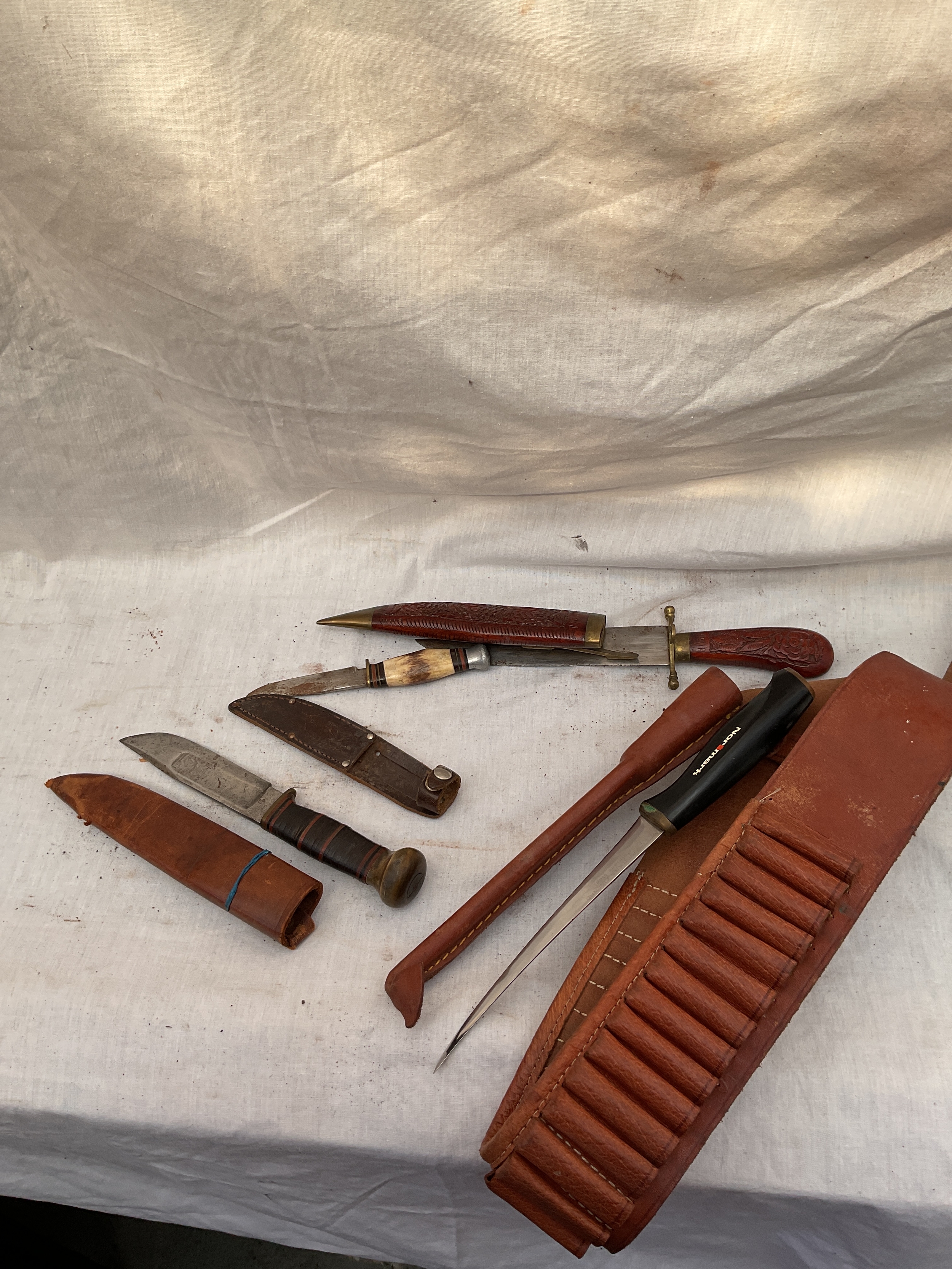 Four knives to inc ammo belt and Fiskard skinning knife.